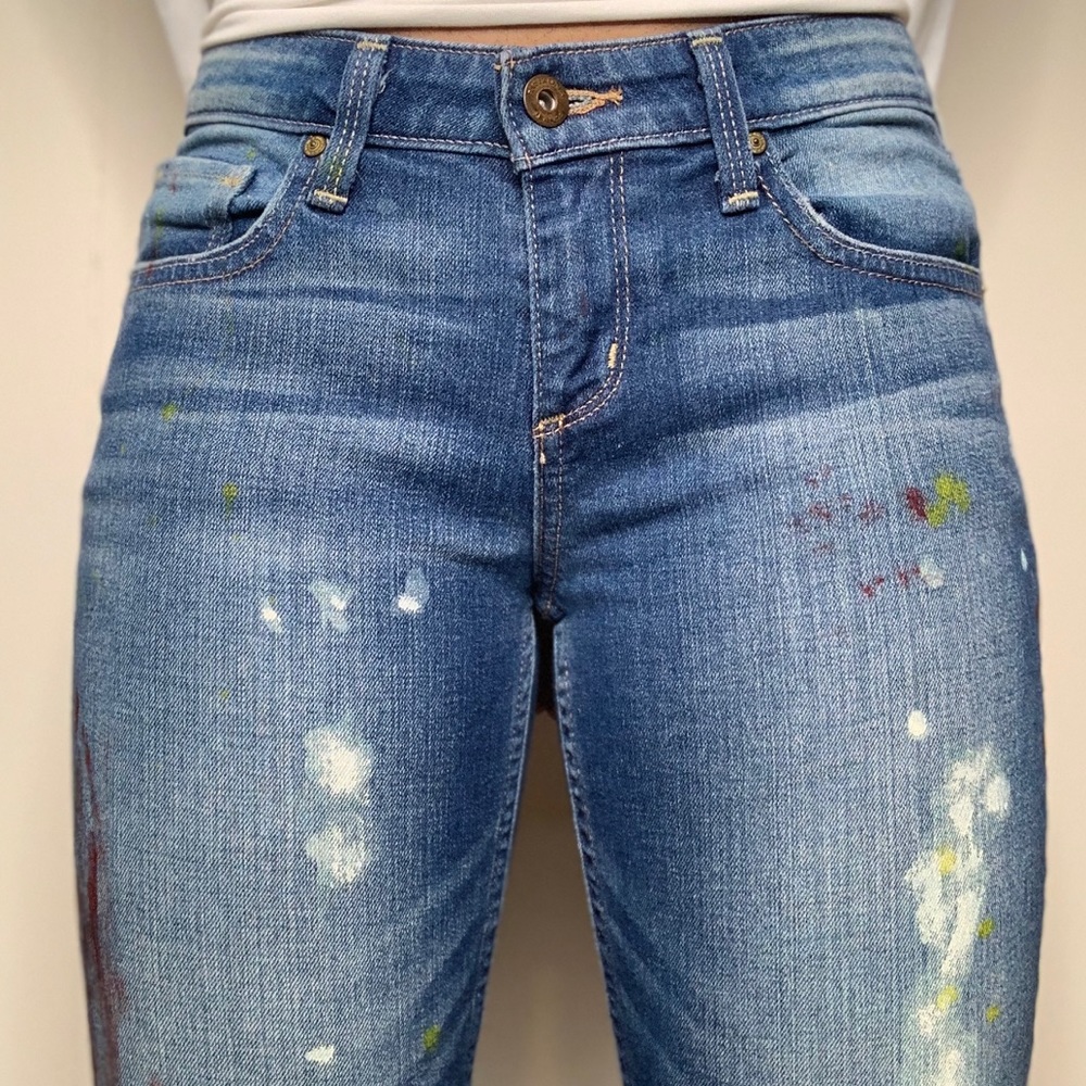 Boot cut paint splattered jeans
